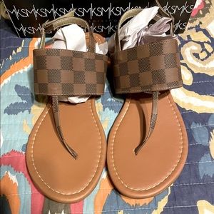 Brown checkered sandals.